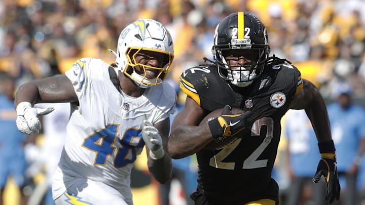 Sep 22, 2024; Pittsburgh, Pennsylvania, USA;  Pittsburgh Steelers running back Najee Harris (22) runs the ball as Los Angeles Chargers Los Angeles Chargers linebacker Bud Dupree (48) chases during the fourth quarter at Acrisure Stadium. Pittsburgh won 20-10. Mandatory Credit: Charles LeClaire-Imagn Images
