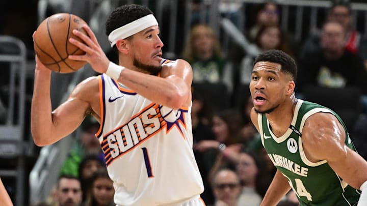 Apr 1, 2025; Milwaukee, Wisconsin, USA; Phoenix Suns guard Devin Booker (1) looks for a shot against Milwaukee Bucks forward Giannis Antetokounmpo (34) in the third quarter at Fiserv Forum. Mandatory Credit: Benny Sieu-Imagn Images Apr 1, 2025; Milwaukee, Wisconsin, USA; Phoenix Suns guard Devin Booker (1) looks for a shot against Milwaukee Bucks forward Giannis Antetokounmpo (34) in the third quarter at Fiserv Forum. Mandatory Credit: Benny Sieu-Imagn Images