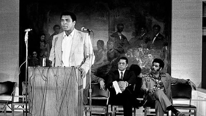 World heavyweight boxing champion Muhammad Ali, left, speaks on the campus of Fisk University in 1975. 