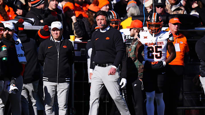 Nov 29, 2024; Boulder, Colorado, USA; Oklahoma State Cowboys head coach Mike Gundy walks the sidelines the second quarter against the Colorado Buffaloes at Folsom Field. Mandatory Credit: Ron Chenoy-Imagn Images