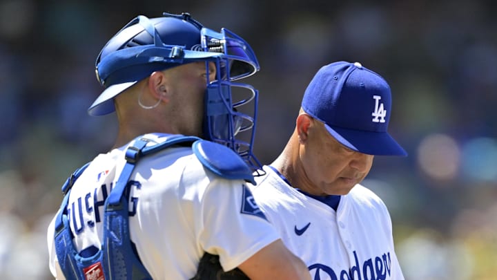 Dodgers catcher Dalton Rushing (68) waits with manager Dave Roberts (30) on the mound during a pitching change in the eighth inning against the Houston Astros at Dodger Stadium on July 6.