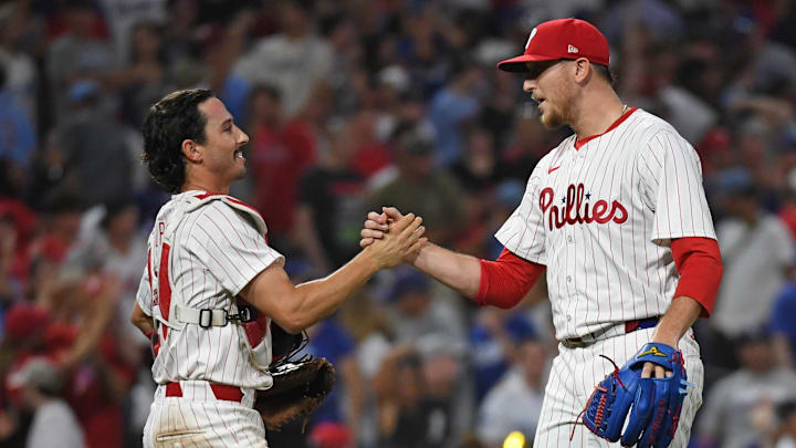 Jul 10, 2024; Philadelphia, Pennsylvania, USA; Philadelphia Phillies catcher Garrett Stubbs (21) and pitcher Jeff Hoffman (23) celebrate win against the Los Angeles Dodgers at Citizens Bank Park. Jul 10, 2024; Philadelphia, Pennsylvania, USA; Philadelphia Phillies catcher Garrett Stubbs (21) and pitcher Jeff Hoffman (23) celebrate win against the Los Angeles Dodgers at Citizens Bank Park.