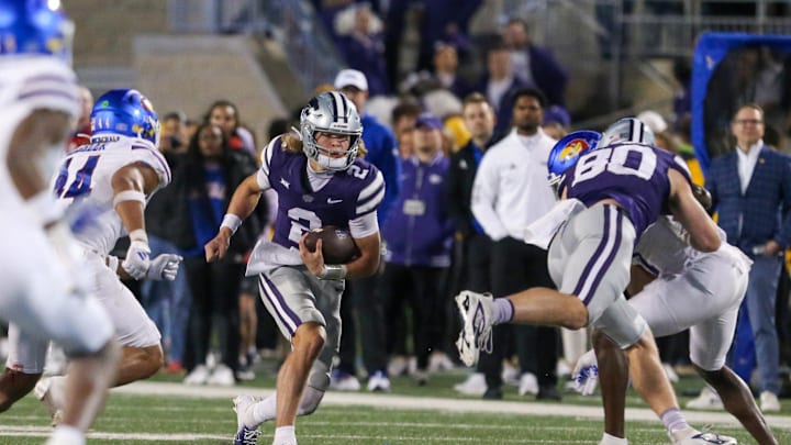 Oct 26, 2024; Manhattan, Kansas, USA; Kansas State Wildcats quarterback Avery Johnson (2) looks for room to run against the Kansas Jayhawks in the fourth quarter at Bill Snyder Family Football Stadium. Mandatory Credit: Scott Sewell-Imagn Images Oct 26, 2024; Manhattan, Kansas, USA; Kansas State Wildcats quarterback Avery Johnson (2) looks for room to run against the Kansas Jayhawks in the fourth quarter at Bill Snyder Family Football Stadium. Mandatory Credit: Scott Sewell-Imagn Images