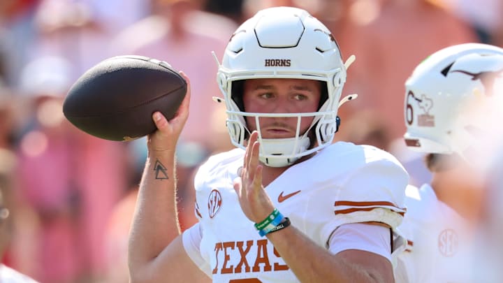 Oct 12, 2024; Dallas, Texas, USA;  Texas Longhorns quarterback Quinn Ewers (3) warms up before the game against the Oklahoma Sooners at the Cotton Bowl. Mandatory Credit: Kevin Jairaj-Imagn Images