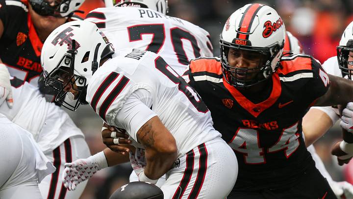Oregon State's Takari Hickle, right, knocks the ball away from Texas Tech's Cameron Dickey. Oregon State's Takari Hickle, right, knocks the ball away from Texas Tech's Cameron Dickey.
