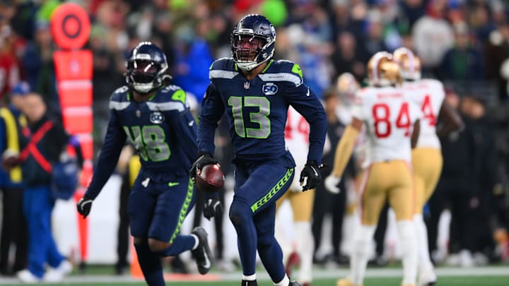 Jan 17, 2026; Seattle, WA, USA; Seattle Seahawks linebacker Ernest Jones IV (13) reacts after an interception against the San Francisco 49ers during the second half in an NFC Divisional Round game at Lumen Field. 