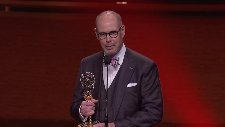 Turner Sports host Ernie Johnson captured the Sports Emmy for Outstanding Personality/Studio Host on Tuesday night.