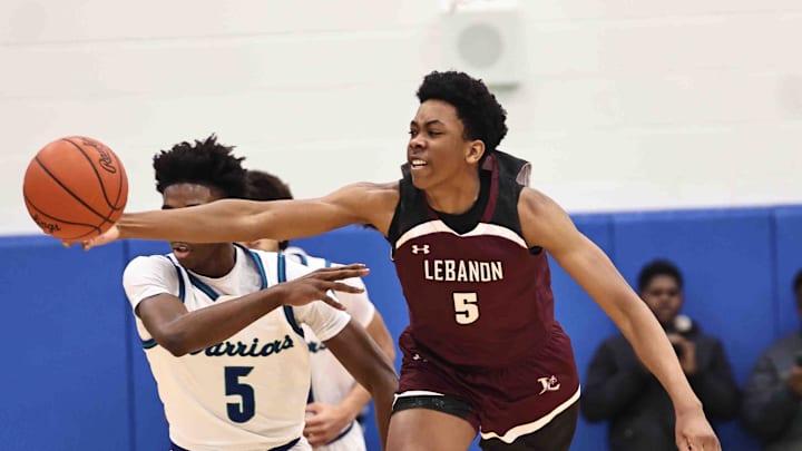 Lebanon forward Anthony Thompson (5) battles Winton Woods guard Nate Dawson (5) for a loose ball during their 50-61 loss Friday, Jan. 5, 2024. Lebanon forward Anthony Thompson (5) battles Winton Woods guard Nate Dawson (5) for a loose ball during their 50-61 loss Friday, Jan. 5, 2024.