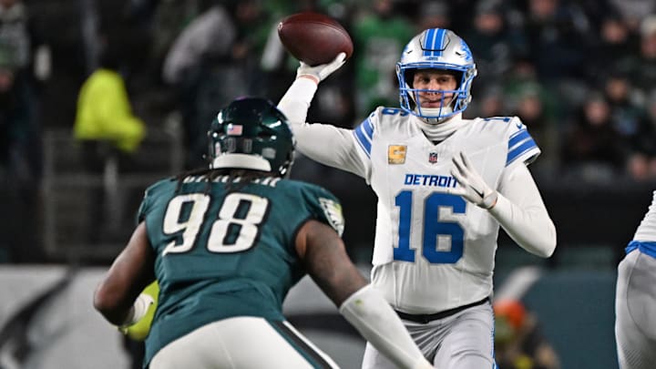 Nov 16, 2025; Philadelphia, Pennsylvania, USA; Detroit Lions quarterback Jared Goff (16) throws a pass under pressure form Philadelphia Eagles defensive tackle Jalen Carter (98) during the second half at Lincoln Financial Field. Mandatory Credit: Eric Hartline-Imagn Images
