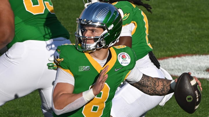 Jan 1, 2025; Pasadena, CA, USA; Oregon Ducks quarterback Dillon Gabriel (8) throws a pass during the second quarter against the Ohio State Buckeyes at Rose Bowl Stadium. Mandatory Credit: Robert Hanashiro-Imagn Images