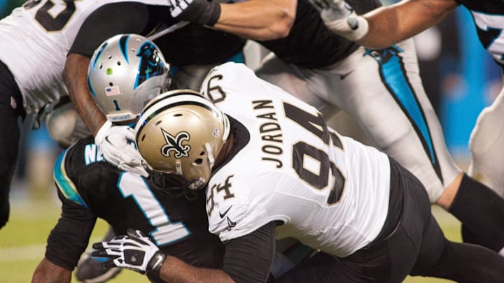Oct 30, 2014; Charlotte, NC, USA; New Orleans Saints defensive end Cameron Jordan (94) sacks Carolina Panthers quarterback Cam Newton (1) during the second quarter at Bank of America Stadium. Mandatory Credit: Jeremy Brevard-Imagn Images