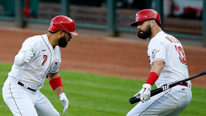 Cincinnati Reds third baseman Eugenio Suarez (7) and designated hitter Jesse Winker (33) celebrate.