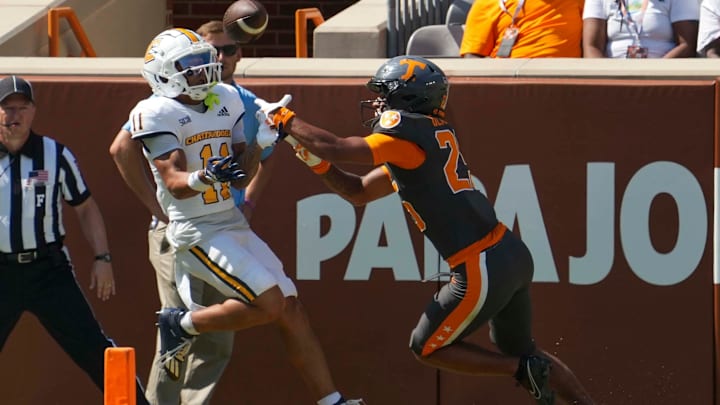 Tennessee defensive back Kaleb Beasley (25) stops Chattanooga wide receiver Sam Phillips (11) from catching the ball during a football game between Tennessee and Chattanooga at Neyland Stadium in Knoxville, Tenn., on Saturday, August 31, 2024.