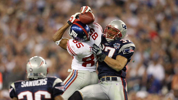 Feb 3, 2008; Glendale, AZ, USA; New York Giants wide receiver David Tyree (85) pulls down a pass over New England Patriots safety Rodney Harrison (37) in the fourth quarter of Super Bowl XLII at the University of Phoenix Stadium. New York Giants defeated the New England Patriots with a final of 17-14. Feb 3, 2008; Glendale, AZ, USA; New York Giants wide receiver David Tyree (85) pulls down a pass over New England Patriots safety Rodney Harrison (37) in the fourth quarter of Super Bowl XLII at the University of Phoenix Stadium. New York Giants defeated the New England Patriots with a final of 17-14.
