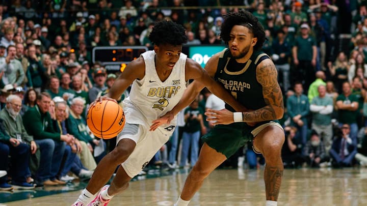 Pressure from Colorado State Rams guard Josh Pascarelli (1 Pressure from Colorado State Rams guard Josh Pascarelli (1
