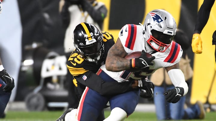 New England Patriots running back Ezekiel Elliott is stopped by Pittsburgh Steelers cornerback Levi Wallace.