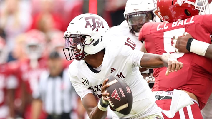 Oct 18, 2025; Fayetteville, Arkansas, USA; Texas A&M Aggies quarterback Marcel Reed (10) rushes in the first quarter against the Arkansas Razorbacks at Donald W. Reynolds Razorback Stadium. Mandatory Credit: Nelson Chenault-Imagn Images Oct 18, 2025; Fayetteville, Arkansas, USA; Texas A&M Aggies quarterback Marcel Reed (10) rushes in the first quarter against the Arkansas Razorbacks at Donald W. Reynolds Razorback Stadium. Mandatory Credit: Nelson Chenault-Imagn Images
