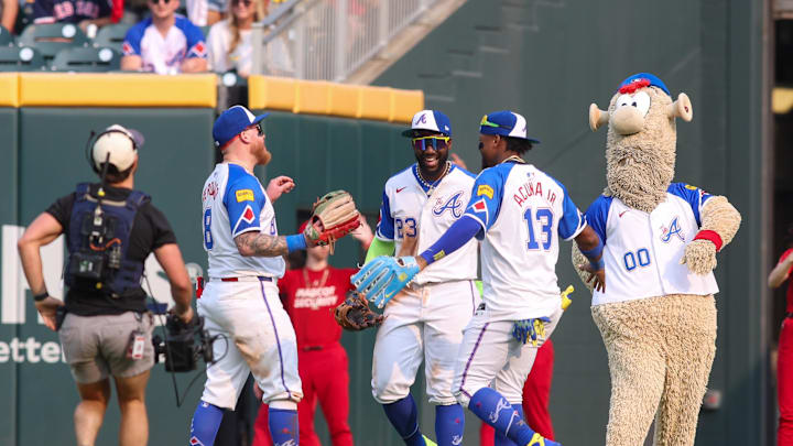 May 31, 2025; Atlanta, Georgia, USA; Atlanta Braves left fielder Alex Verdugo (8) and center fielder Michael Harris II (23) and right fielder Ronald Acuna Jr. (13) celebrate after a victory over the Boston Red Sox at Truist Park. Mandatory Credit: Brett Davis-Imagn Images