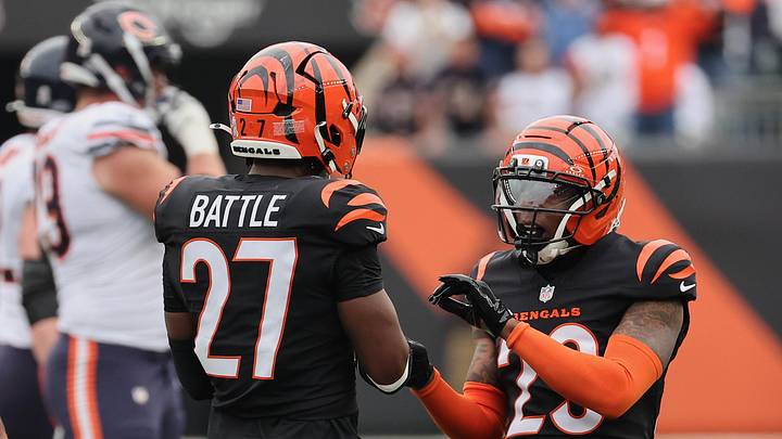 Cincinnati Bengals cornerback Dax Hill celebrates with safety Jordan Battle.