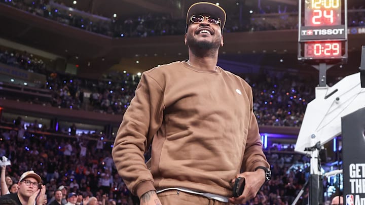 Apr 29, 2025; New York, New York, USA; Former NBA forward Carmelo Anthony waves to the crowd during game five of first round for the 2025 NBA Playoffs between the against the Detroit Pistons and the New York Knicks at Madison Square Garden. Mandatory Credit: Wendell Cruz-Imagn Images