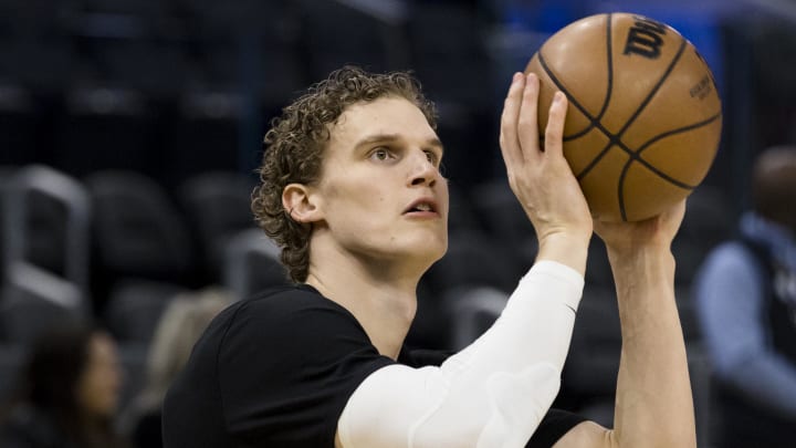 Utah Jazz forward Lauri Markkanen (23) shoots during warmups before the game against the Golden State Warriors at Chase Center.