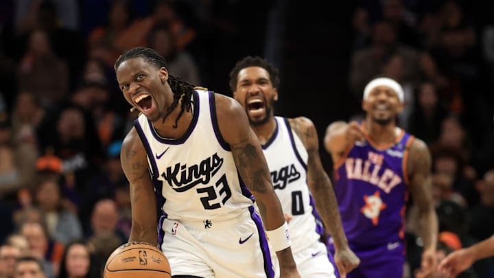 Mar 14, 2025; Phoenix, Arizona, USA; Sacramento Kings guard Keon Ellis (23) and Malik Monk (0) react against the Phoenix Suns at Footprint Center. Mandatory Credit: Mark J. Rebilas-Imagn Images
