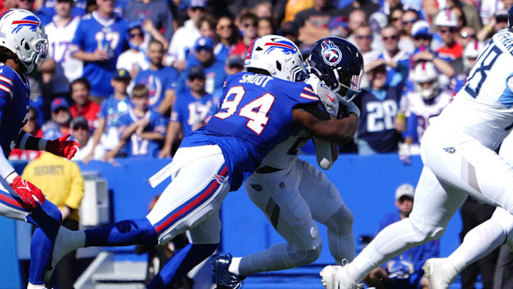 Oct 20, 2024; Orchard Park, New York, USA; Buffalo Bills defensive end Dawuane Smoot (94) tackles Tennessee Titans running back Tony Pollard (20) during the first half at Highmark Stadium.