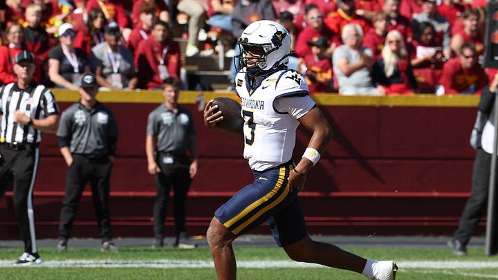 Oct 3, 2026; Ames, Iowa, USA; West Virginia Mountaineers quarterback Michael Hawkins Jr. (3) runs aways from the Iowa State Cyclones defense for a touchdown at Jack Trice Stadium. Mandatory Credit: Reese Strickland-Imagn Images Oct 3, 2026; Ames, Iowa, USA; West Virginia Mountaineers quarterback Michael Hawkins Jr. (3) runs aways from the Iowa State Cyclones defense for a touchdown at Jack Trice Stadium. Mandatory Credit: Reese Strickland-Imagn Images