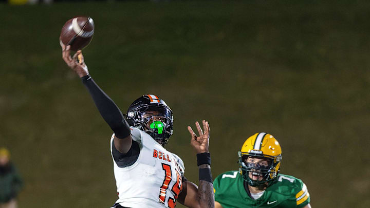Howell's Brody Stack (7) attempts to run down Belleville's Bryce Underwood Friday, Oct. 25, 2024.