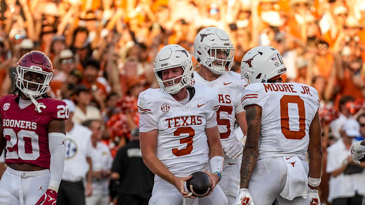 Texas Longhorns quarterback Quinn Ewers (3) celebrates a touchdown run during the Red River Rivalry game against Oklahoma at the Cotton Bowl on Saturday, Oct. 12, 2024 in Dallas, Texas.