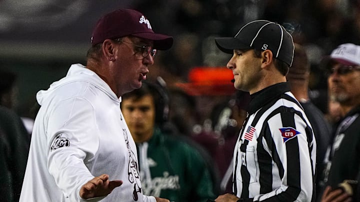 Texas A&M head coach Mike Elko argues with an official about an overturned tageting call against the Texas Longhorns during the Lone Star Showdown at Kyle Field on Saturday, Nov. 30, 2024 in College Station, Texas.