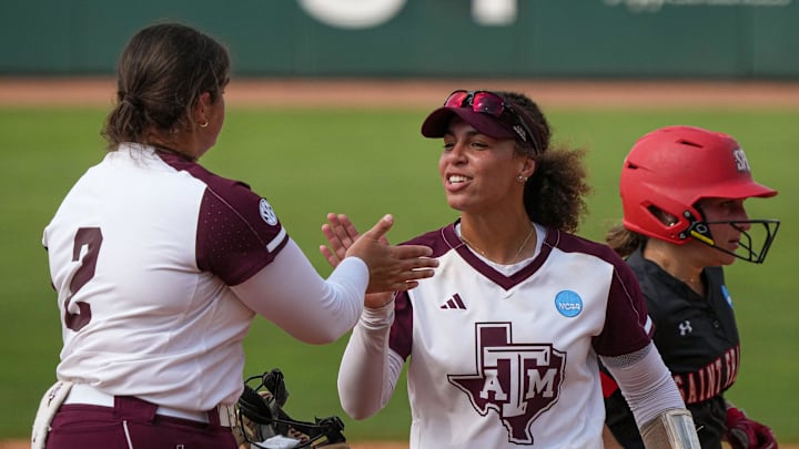 Texas A&M infielder Amari Harper (13) celebrates a strikeout by pitcher Sidne Peters (2) during the NCAA D1 Softball Tournament Regional against Saint Francis University at Davis Diamond at Texas A&M University on Friday, May 16, 2025 in College Station, Texas.