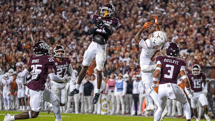 Texas A&M defensive back Will Lee III (26) misses an interception intended for Texas Longhorns receiver DeAndre Moore Jr. (0) during the Lone Star Showdown at Kyle Field. Texas A&M defensive back Will Lee III (26) misses an interception intended for Texas Longhorns receiver DeAndre Moore Jr. (0) during the Lone Star Showdown at Kyle Field.