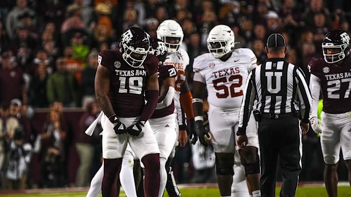 Texas A&M defensive lineman Cashius Howell (18) celebrates a defensive stop during the Lone Star Showdown against the Texas Longhorns at Kyle Field. Texas A&M defensive lineman Cashius Howell (18) celebrates a defensive stop during the Lone Star Showdown against the Texas Longhorns at Kyle Field.