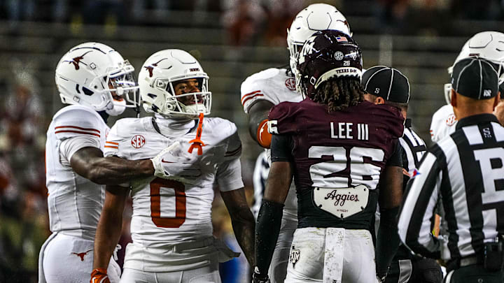 Texas Longhorns receiver DeAndre Moore Jr. (0) gets into a verbal argument with Texas A&M defensive back Will Lee III (26) during the Lone Star Showdown at Kyle Field.
