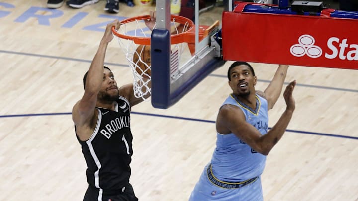 Mar 23, 2022; Memphis, Tennessee, USA; Brooklyn Nets guard-forward Bruce Brown (1) dunks as Memphis Grizzlies guard De'Anthony Melton (0) defends during the second half at FedExForum. Mandatory Credit: Petre Thomas-Imagn Images Mar 23, 2022; Memphis, Tennessee, USA; Brooklyn Nets guard-forward Bruce Brown (1) dunks as Memphis Grizzlies guard De'Anthony Melton (0) defends during the second half at FedExForum. Mandatory Credit: Petre Thomas-Imagn Images