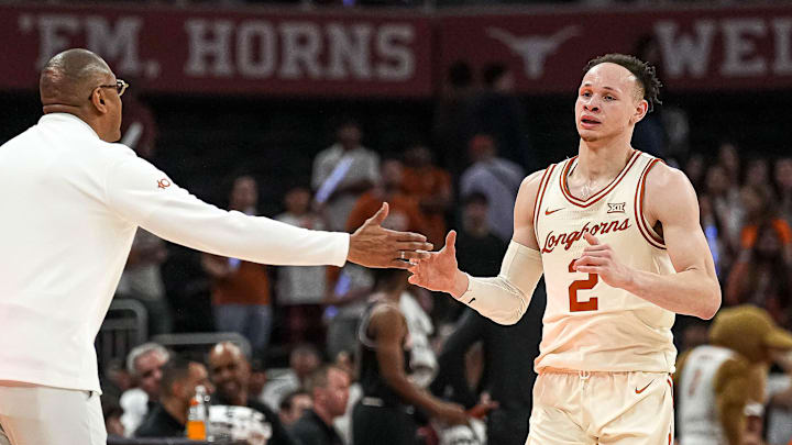 Texas Longhorns head coach Rodney Terry celebrates with guard Chendall Weaver (2) Texas Longhorns head coach Rodney Terry celebrates with guard Chendall Weaver (2)