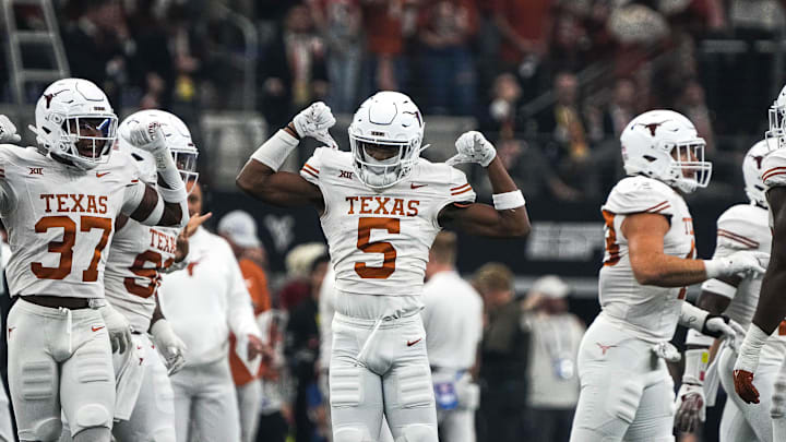 Texas Longhorns defensive back Malik Muhammad (5) celebrates a defensive stop during the Big 12 Championship game against the Oklahoma State Cowboys at AT&T stadium on Saturday, Dec. 2, 2023 in Arlington.