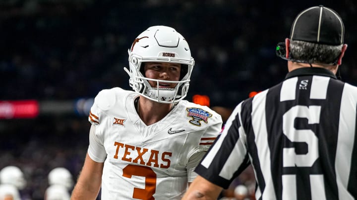 Texas Longhorns quarterback Quinn Ewers (3) talks to an official during the Sugar Bowl College Football Playoff  semifinals game against the Washington Huskies at the Caesars Superdome on Monday, Jan. 1, 2024 in New Orleans, Louisiana.
