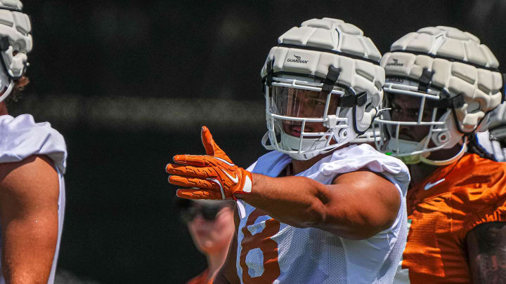 Trey Moore (8) edge for the Texas Longhorns directs team mates during defensive drills at practice at Frank Denius Fields on Thursday, Aug. 1, 2024 in Austin. Trey Moore (8) edge for the Texas Longhorns directs team mates during defensive drills at practice at Frank Denius Fields on Thursday, Aug. 1, 2024 in Austin.