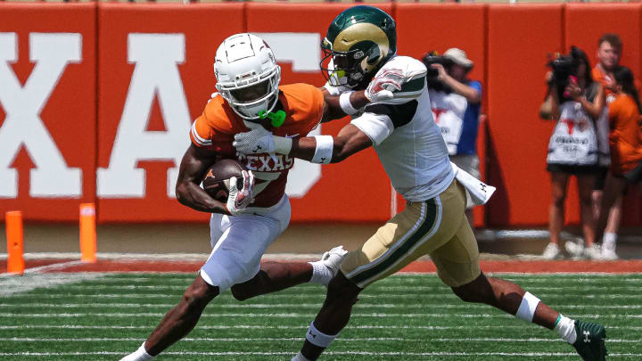 Texas Longhorns receiver Isaiah Bond (7) is tackled by Colorado State defensive back Dom Jones (7) during the game at Darrell K Royal-Texas Memorial Stadium in Austin Saturday, Aug. 31, 2024. Texas Longhorns receiver Isaiah Bond (7) is tackled by Colorado State defensive back Dom Jones (7) during the game at Darrell K Royal-Texas Memorial Stadium in Austin Saturday, Aug. 31, 2024.