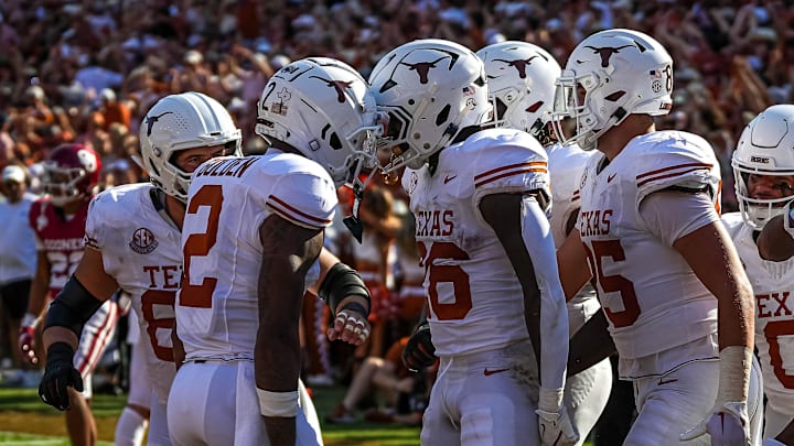 Texas Longhorns receiver Silas Bolden (11) celebrates a touchdown by running back Quintrevion Wisner (26) during the Red River Rivalry game against Oklahoma at the Cotton Bowl on Saturday, Oct. 12, 2024 in Dallas, Texas.