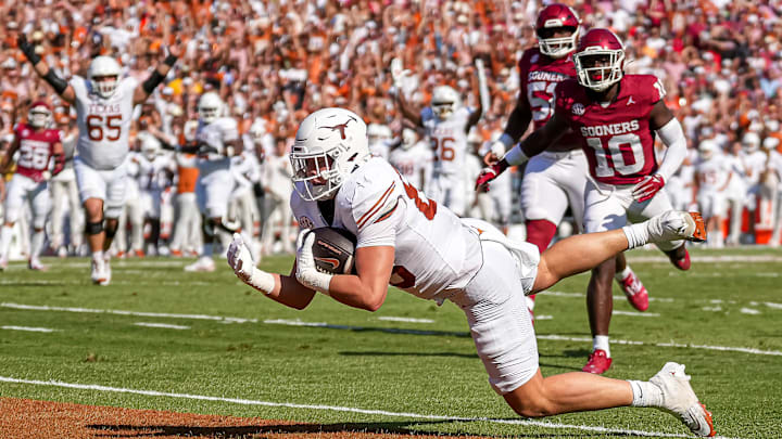 Texas Longhorns tight end Gunnar Helm (85) dives for the first Texas touchdown during the Red River Rivalry game against Oklahoma at the Cotton Bowl on Saturday, Oct. 12, 2024 in Dallas, Texas.