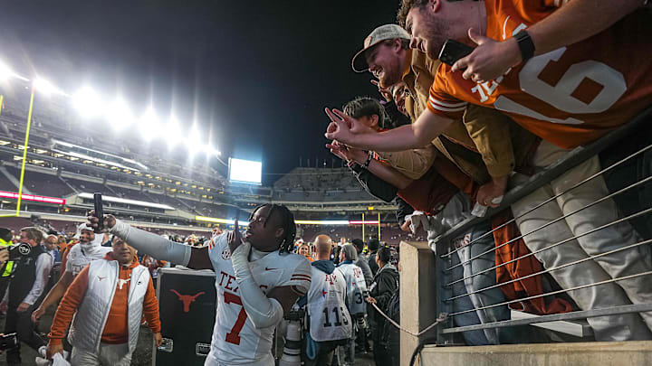 Nov 30, 2024; College Station, Texas, USA; Texas Longhorns defensive back Jahdae Barron (7) takes a photo with Texas fans after the 17-7 win over Texas A&M in the Lone Star Showdown at Kyle Field. Mandatory Credit: Sara Diggins/USA TODAY Network via Imagn Images