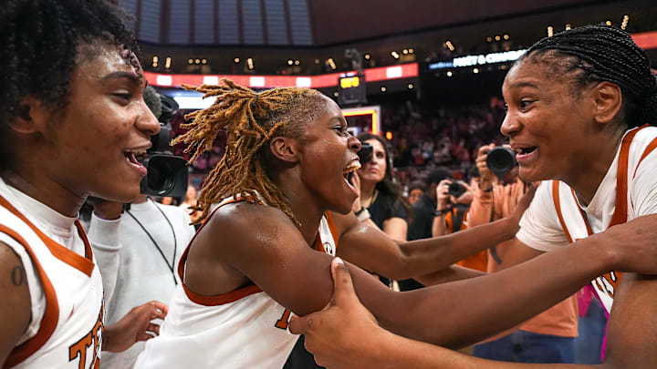 From right, Texas Longhorns guards Madison Booker, Bryanna Preston, and Rori Harmon celebrate the 65-58 win over LSU at the Moody Center on Sunday, Feb. 16, 2025.