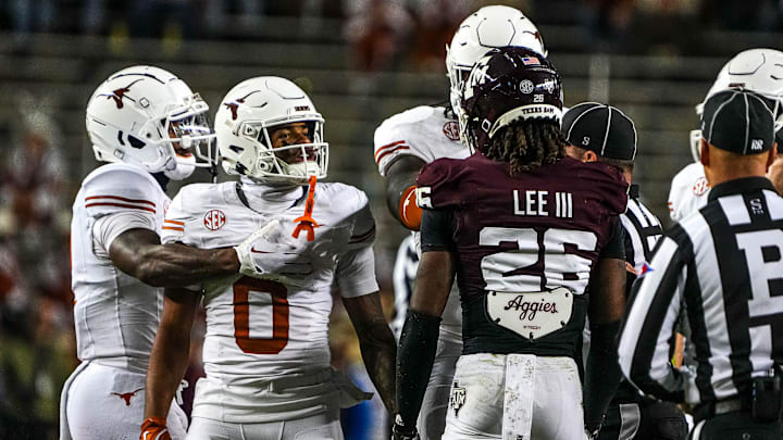 Texas Longhorns receiver DeAndre Moore Jr. (0) gets into a verbal argument with Texas A&M defensive back Will Lee III (26) during the Lone Star Showdown at Kyle Field on Saturday, Nov. 30, 2024 in College Station, Texas.