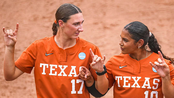 Texas Longhorns pitcher Teagan Kavan (17) and infielder Mia Scott (10) celebrate winning the NCAA D1 Softball Tournament Regional against UCF at Red and Charline McCombs Field on Sunday, May 18, 2025 in Austin, Texas.