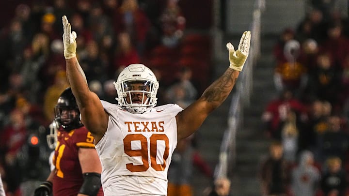 Texas Longhorns defensive lineman Byron Murphy II (90) celebrates sacking Iowa State quarterback Rocco Becht (3) during the game at Jack Trice Stadium on Saturday, Nov. 8, 2023 in Ames, Iowa. Texas Longhorns defensive lineman Byron Murphy II (90) celebrates sacking Iowa State quarterback Rocco Becht (3) during the game at Jack Trice Stadium on Saturday, Nov. 8, 2023 in Ames, Iowa.