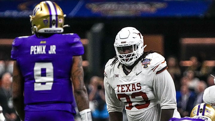Texas Longhorns defensive lineman T'Vondre Sweat watches Washington quarterback Michael Penix Jr. before a snap during the Sugar Bowl College Football Playoff semifinals game
