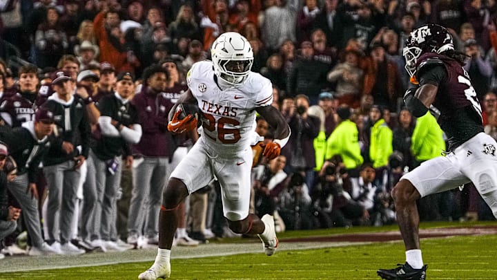 Texas Longhorns running back Quintrevion Wisner (26) runs the ball during the Lone Star Showdown against the Texas A&M Aggies at Kyle Field on Saturday, Nov. 30, 2024 in College Station, Texas.